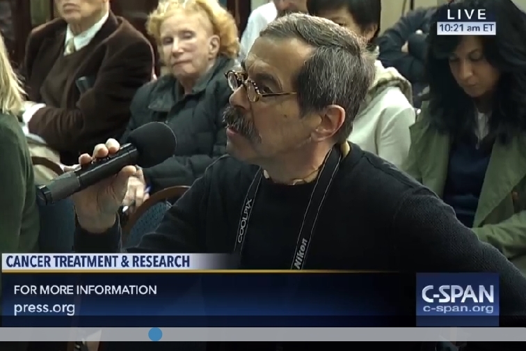 C-Span screenshot of Alan Kotok speaking into a handheld microphone, Nov. 2016